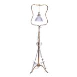 An early 20th century brass telescopic floor lamp in the art nouveau taste, with suspended single