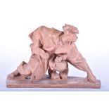 A large Russian terracotta figural sculpture modelled as a crouched individual holding a pair of