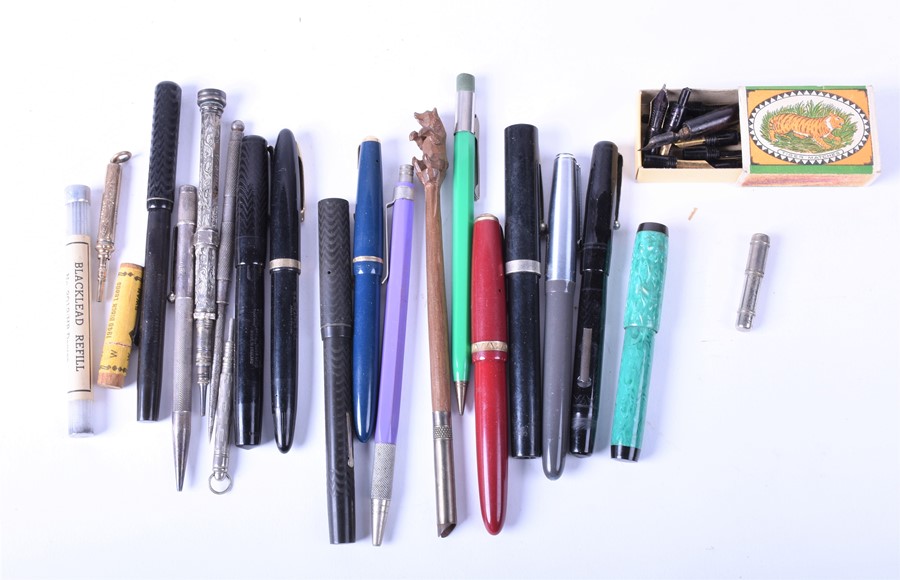 A collection of vintage/antique fountain pens and pencils to include various bakelite and silver