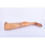 An early 1920s leather and wood 'Anglesey limb' prosthetic leg made from carved and polished willow