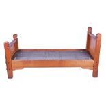 A rare pair of Arts & Crafts style chestnut single bed frames by Stanley Webb Davies  the headboards