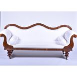 A Regency double scroll end mahogany settee upholstered with white fabric, the frame designed with