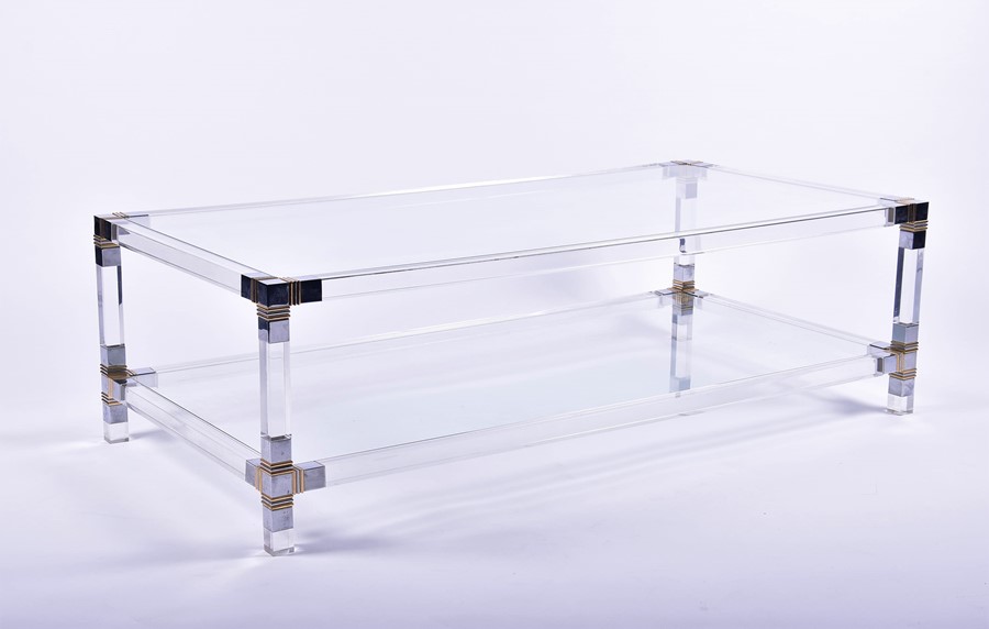 A 20th century modern glass coffee table of rectangular shape, the corners mounted with gilt and