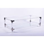 A 20th century modern glass coffee table of rectangular shape, the corners mounted with gilt and