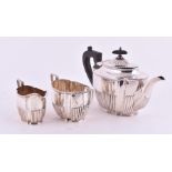 A late Victorian silver three-piece tea set Sheffield 1896 & 1897, by George Howson, retailed by