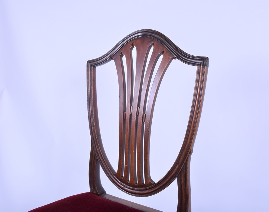 A set of four mahogany Hepplewhite style shield back dining chairs with overstuffed seats, on - Image 4 of 4