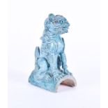 A Chinese turquoise glazed pottery model of a Foo dog in a seated position, possibly made to be a