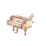 A 20th century Viennese enamel piano shaped music box in the Rococo taste, designed as a grand piano