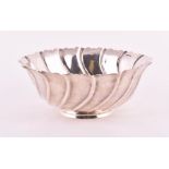 An Irish silver bowl Dublin 1898, by West & Son, of circular fluting form with shaped rim, impressed