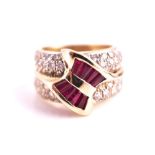 A 14ct yellow gold, diamond, and ruby cocktail ring the stylised mount inset with calibre-set