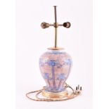 A 20th century Oriental painted table lamp of baluster form, the body painted with blue flowers