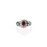 An early to mid 19th century yellow metal, garnet, pearl, and turquoise ring centred with a collet-