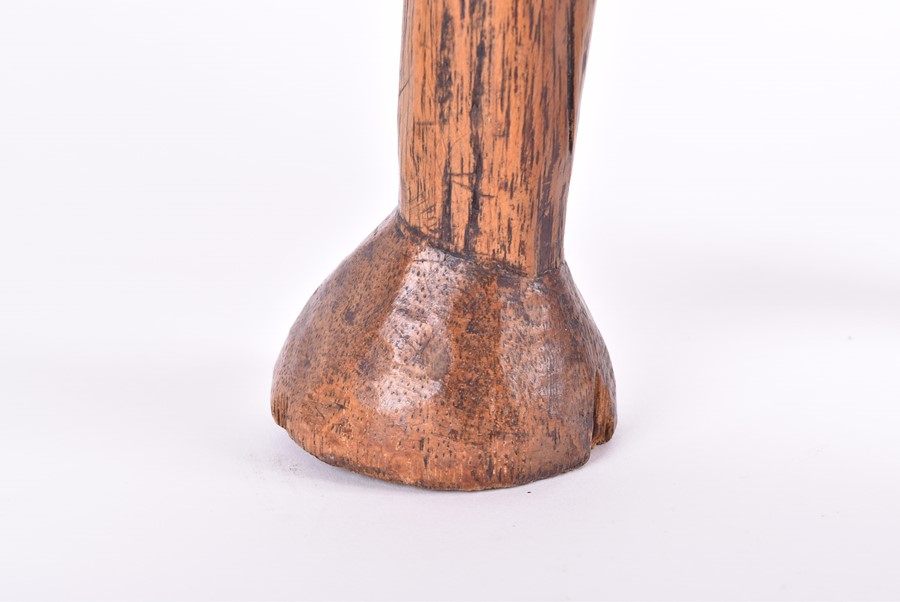 A carved African fertility sculpture modelled as an animalistic figure, 31.5 cm high, together - Image 7 of 20