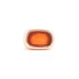 A yellow metal and carnelian signet ring inset with a carnelian intaglio depicting a running dog and