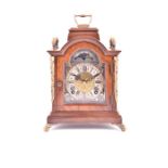 A Regency style brass mounted mahogany bracket clock probably Dutch, the central dial with Roman