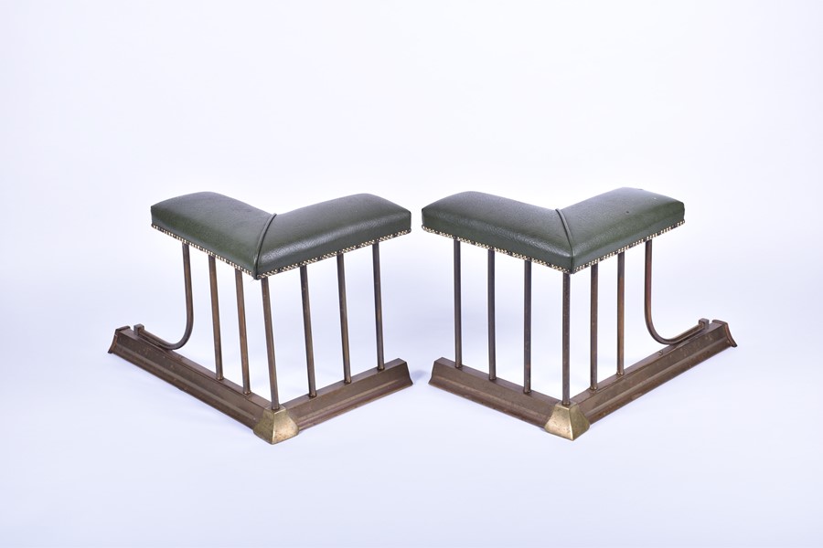 A pair of 20th century brass and leather club fenders the brass rails surmounted with over-stuffed