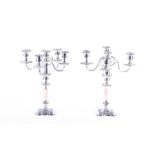 A pair of Sheffield Plate five-light candelabra  with scroll arms, urn-shaped capitals and square