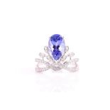 An 18ct white gold, diamond, and tanzanite ring set with a pear-cut tanzanite of approximately 2.