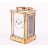 A late 19th / early 20th century brass carriage clock by James Foord the white enamel dial with back