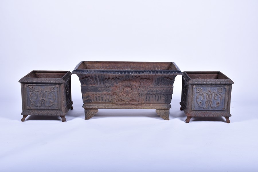 A pair of 20th century cast iron planters of square form with panels of raised foliage motifs and - Image 6 of 12