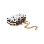 An Oscar de la Renta crown Goa evening bag embellished with white beads on a black background,