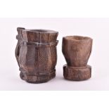 A 19th century or earlier large hardwood drinking vessel with incised geometric design along with