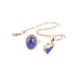 A 9ct yellow gold, diamond, and lapis lazuli pendant set with a triangular lapis plaque in