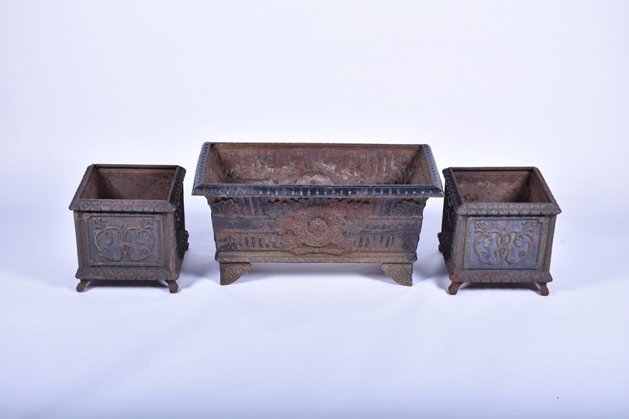 A pair of 20th century cast iron planters of square form with panels of raised foliage motifs and - Image 5 of 12