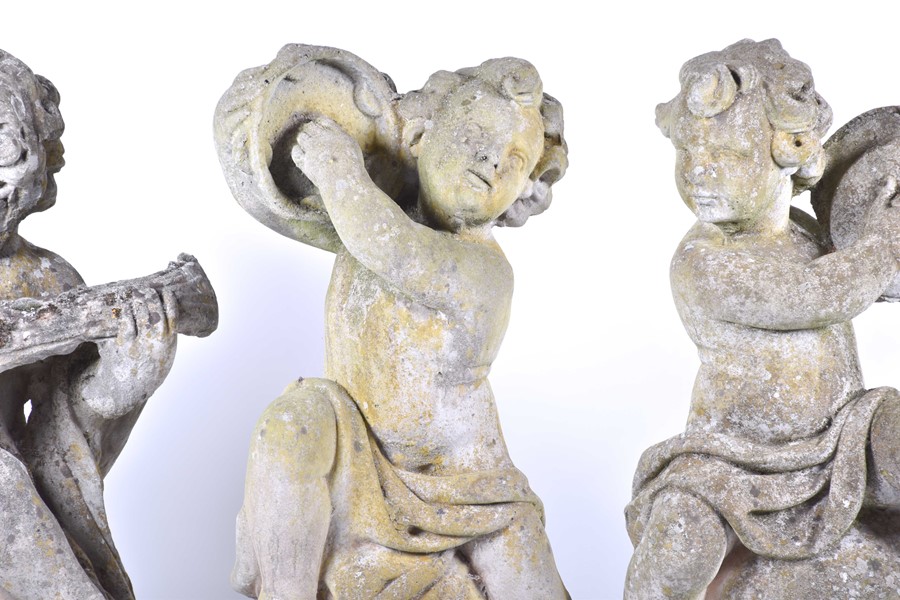 A set of four 20th century Italian musical cherub stoneware sculptures each seated on a sphere, - Image 4 of 17