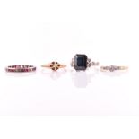 An 18ct white gold, diamond and dark green gemstone ring set with a stepped rectangular-cut greenish