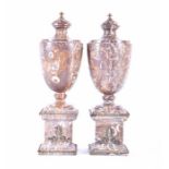 A pair of classical marble gilt metal mounted urns in a rich included brown marble, with metal
