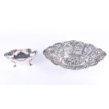 A white metal reticulated oval dish with repousse decoration to centre, stamped 800, 40 cm long,