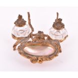 A 19th century ormolu and mother-of-pearl double inkwell designed with naturalistic foliage