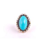 An unusual yellow gold, diamond, sapphire, and turquoise cocktail ring set with a large oval