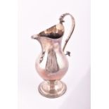 A George III silver beer/water jug London 1784, by Walter Brind, of plain bulbous form on a