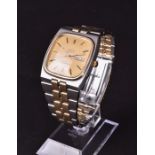 A 1970s Omega Constellation two tone quartz wristwatch the square gilt dial with baton hour