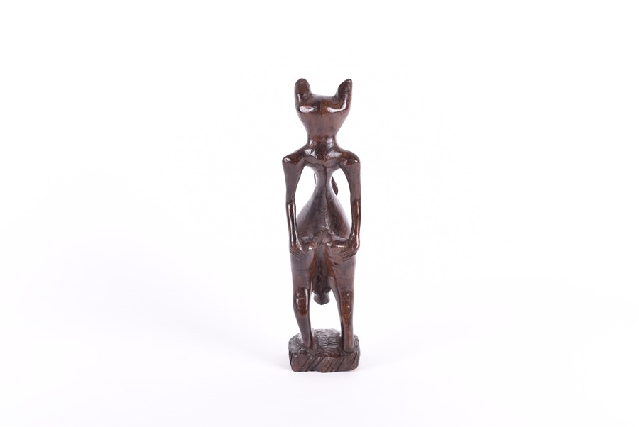 A carved African fertility sculpture modelled as an animalistic figure, 31.5 cm high, together - Image 19 of 20