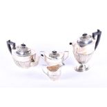 A silver four piece tea set Birmingham 1957, by Barker Brothers Silver Ltd, comprising: a tea pot, a