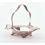 A George V silver basket London 1910, by Josiah Williams & Co., of shaped oval form, with shell