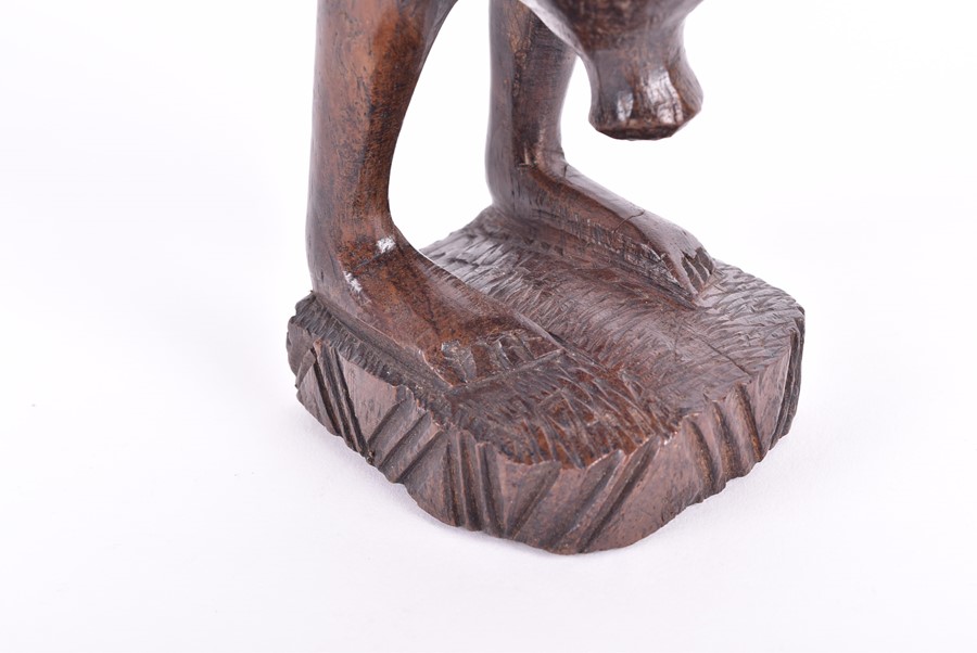 A carved African fertility sculpture modelled as an animalistic figure, 31.5 cm high, together - Image 20 of 20