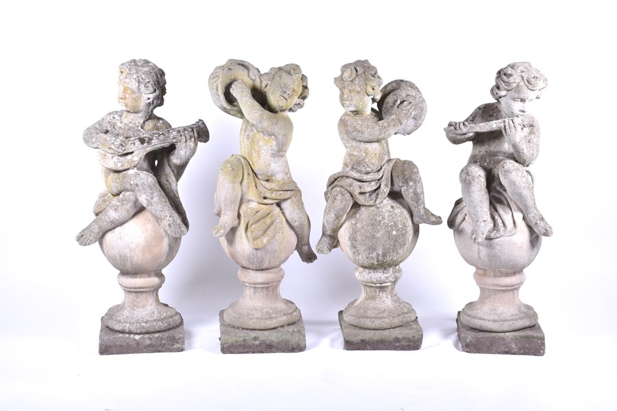 A set of four 20th century Italian musical cherub stoneware sculptures each seated on a sphere, - Image 2 of 17