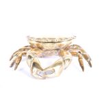 An early 20th century novelty brass inkwell in the form of a crab with hinged cover, enclosing a