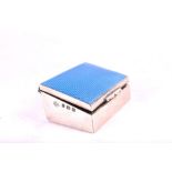 A silver stamp box with blue guilloche enamel lid hallmarked Birmingham 1921, approx 5.5 cm x 4 cm.