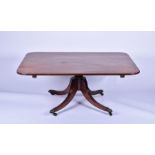 A 19th century mahogany rectangular pedestal low table on converted column and four swept legs,