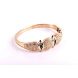 An 18ct yellow gold, diamond, and sapphire bracelet the bangle  with three rows of graduated