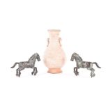 A pair of Tang style bronze horses both modelled in a galloping stance and heavily patinated,