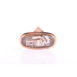 A 19th century yellow gold momento mori ring set with an oval portrait miniature depicting a