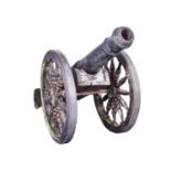 A 19th century cast iron cannon on a gun carriage the cast iron cannon body measuring 116 cm long