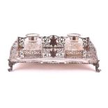 A Victorian silver ink stand London 1888, by Walter & John Barnard, of rectangular form, the sides