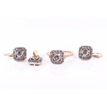 A 14ct yellow gold, diamond, and sapphire ring the chamfered square mount centred with a collet-